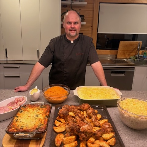 Professional chef preparing weekly batch cooking meals in home kitchen